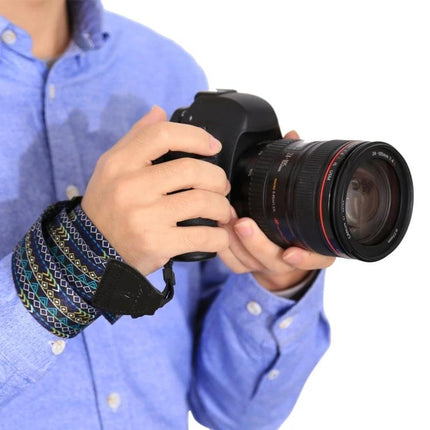 PULUZ Retro Ethnic Style Camera Strap for DSLR Cameras shown on wrist with DSLR camera held securely, vintage woven pattern and padded support