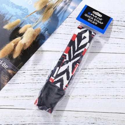 PULUZ Retro Ethnic Style Camera Neck Strap for SLR Cameras in black white red tribal pattern packaged on wooden surface