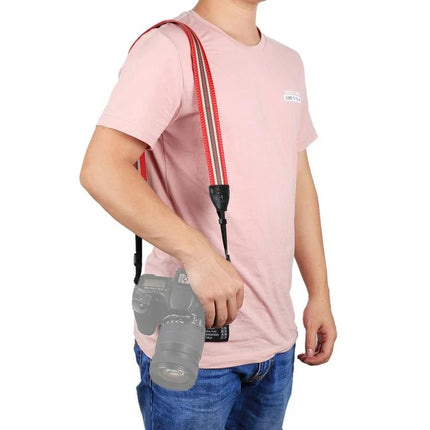 PULUZ Vintage Stripe Camera Neck Strap for SLR Cameras shown worn over shoulder on photographer with red striped cloth strap and SLR camera