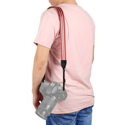 PULUZ Vintage Stripe Camera Neck Strap for SLR Cameras shown worn over shoulder on photographer with SLR