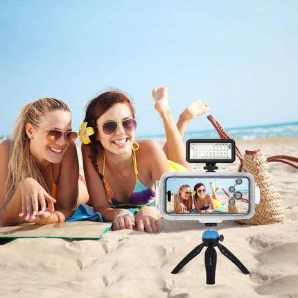 PULUZ 40 LEDs Waterproof Fill Light for Diving Photography showing beach selfie setup with waterproof phone housing and LED light on mini tripod