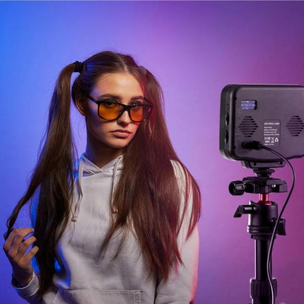 PULUZ Portable Handheld RGB LED Fill Light for Photography illuminating model with pink and blue gel effects