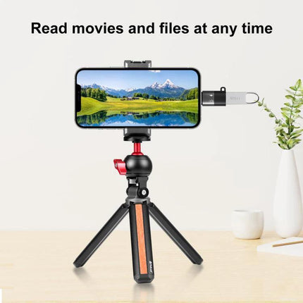 PULUZ USB-C to 8 Pin Adapter for Everyday Device Charging connected to smartphone on tabletop tripod for charging and file transfer