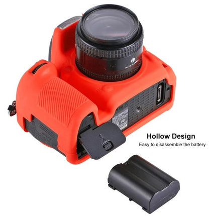PULUZ Soft Silicone Protective Case for Nikon D750 Camera in red showing hollow design and removed battery for easy disassembly