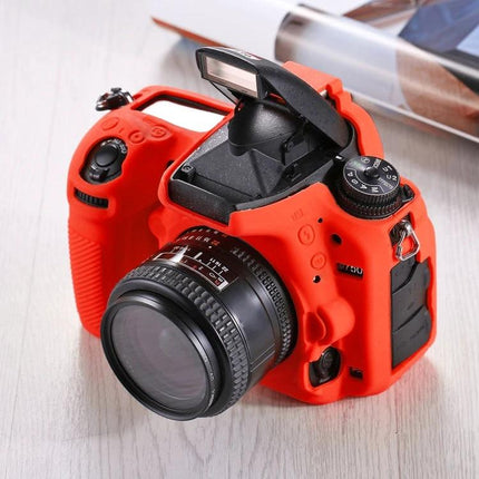 PULUZ Soft Silicone Protective Case for Nikon D750 Camera in red fitted on DSLR showing lens and raised flash