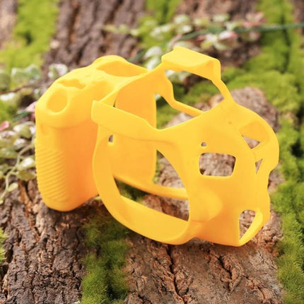 PULUZ Soft Silicone Protective Case for Canon EOS 800D Camera in bright yellow shown on outdoor mossy wood, slim protective silicone cover