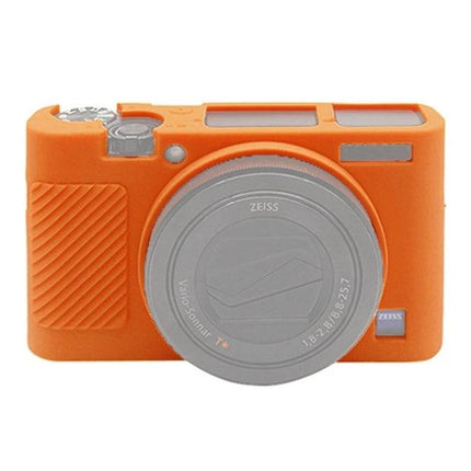 PULUZ Silicone Case to Protect Sony RX100 Cameras in orange fitted on a compact camera, soft stretchable silicone protecting body and lens area
