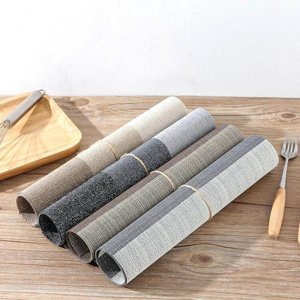 PVC Non Slip Table Mat 30x45cm Easy Clean Placemat in neutral grey and beige tones rolled for kitchen table protection
