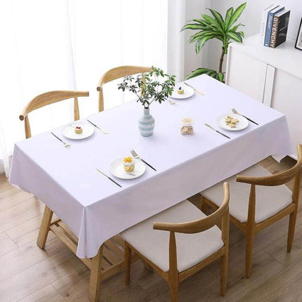 PVC Oil-Proof Waterproof Disposable Tablecloth 140x220 cm on a dining table with imitation hemp texture, waterproof wipe-clean surface and non-slip underside