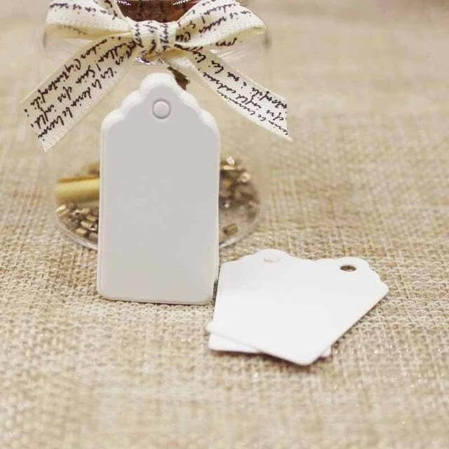 Packaging Label Hang Tags For DIY Food Labels, 10x5 cm - white blank 100-piece pack shown on burlap with jar and ribbon for jam honey spices