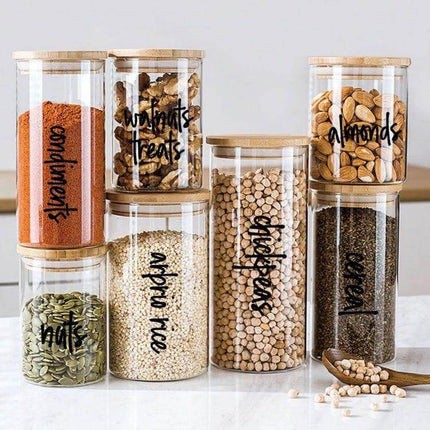 Pantry Label Stickers Waterproof for Jars and Bottles on glass pantry jars with nuts, rice, spices — transparent durable waterproof labels for organized kitchen