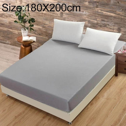 Plain Mattress Protector For Everyday Use Fits 120x200 Cm shown on grey fitted bed with elastic edge for secure fit and spill protection