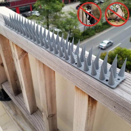 Plastic Bird Repellent Thorns Anti Climb Nails for Fences Brown installed on balcony railing to deter birds and climbers