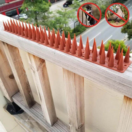 Plastic Bird Repellent Thorns Anti Climb Nails for Fences Brown installed on balcony railing to deter pigeons and cats
