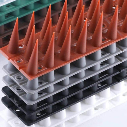 Plastic Bird Repellent Thorns Anti Climb Nails for Fences Brown installed on fence ledge to deter birds and climbers