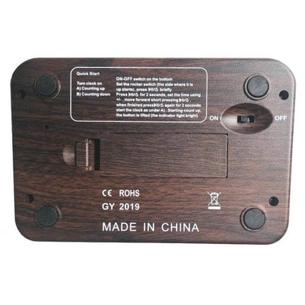 Plastic Chess Clock With Wood Grain Finish For Casual Games – rear view showing wood grain plastic shell, battery cover, ON/OFF switch and LCD controls