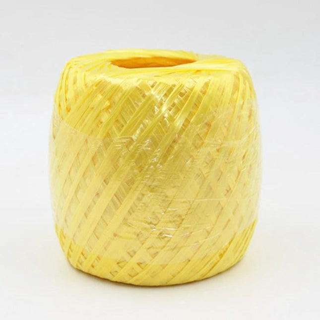 Plastic Strapping Rope Translucent Packaging Tie for Bags in pale yellow roll, lightweight translucent PP twine for gift bags, parcels and decorations