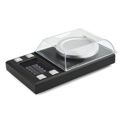Portable Digital Jewelry Scale for Gemstone Weighing on counter showing 1.6-inch display and protective cover, ideal for rings, pendants, loose gemstones