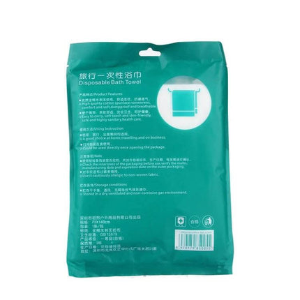 Portable Disposable Travel Cotton Bath Towel 140x65cm in compact green retail pouch showing product info and icon
