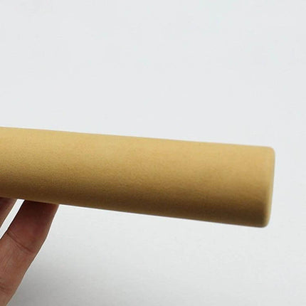 Portable Ice Fishing Rod, 27 cm, Lightweight for Easy Carry — close-up of tan foam handle held by hand, compact carbon fiber ice rod grip