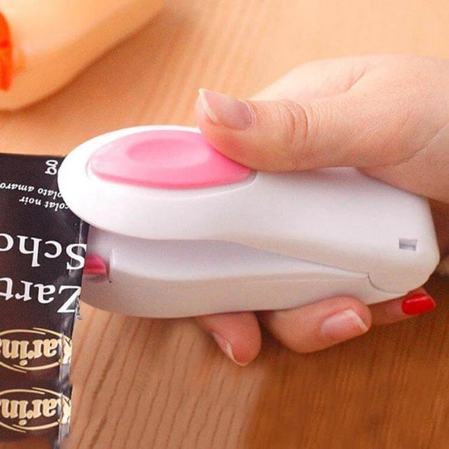 Portable Mini Heat Sealing Machine For Plastic Bags sealing a snack bag with compact handheld design to preserve freshness