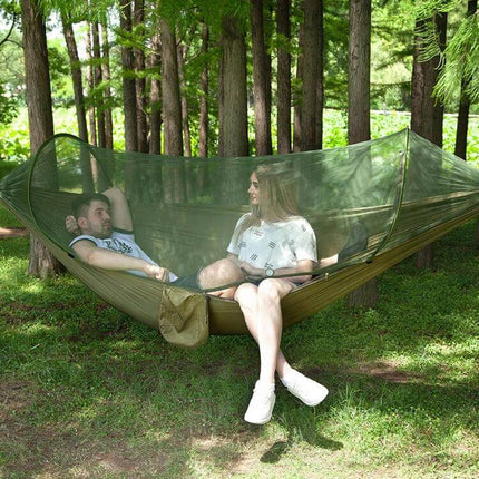 Portable Outdoor Camping Nylon Parachute Hammock 250x120cm with integrated mosquito net showing two people relaxing in a forest setup