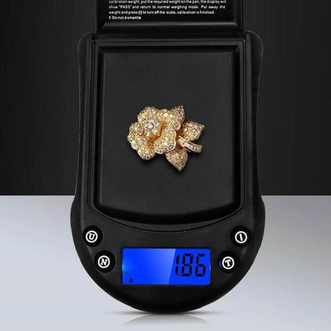 Precision Palm Scale For Jewelry 200g Capacity For Small Items showing a gold floral ring weighed on compact digital scale with 0.01g readability