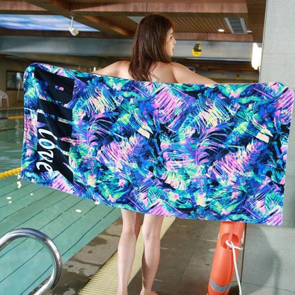 Printed Soft Bath Towel 147x71 cm For Home And Beach showing woman holding colorful printed towel by an indoor pool