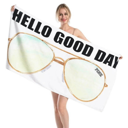 Printed Soft Bath Towel 147x71 cm For Home And Beach - woman holding white printed beach towel with sunglasses graphic and "HELLO GOOD DAY" text