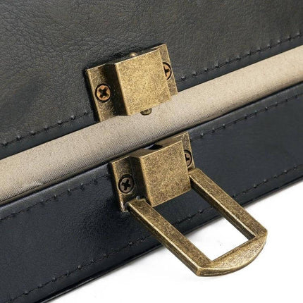 PU Leather Anti-Theft Shield Box for Phone and Keys, Black close-up of black PU leather case with brass latch and RFID-shielded seam, compact 17×12×9 cm
