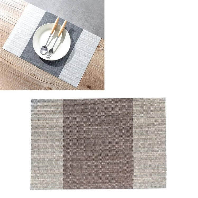 PVC Non Slip Table Mat 30x45cm Easy Clean Placemat in neutral two-tone design on wooden table with plate and cutlery