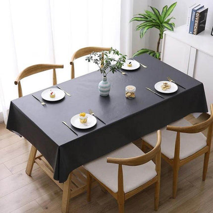 PVC Oil-Proof Waterproof Disposable Tablecloth 140x220 cm on dining table with plates, wipe-clean waterproof surface and imitation hemp texture