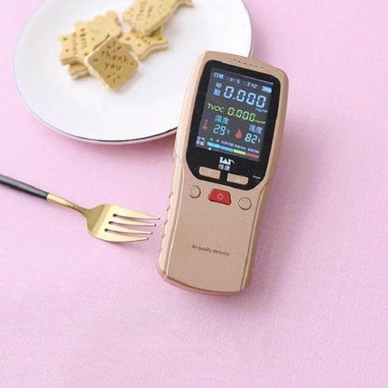 PVC Oil-Proof Waterproof Disposable Tablecloth 140x220 cm on pink table with plate, fork and handheld air quality meter