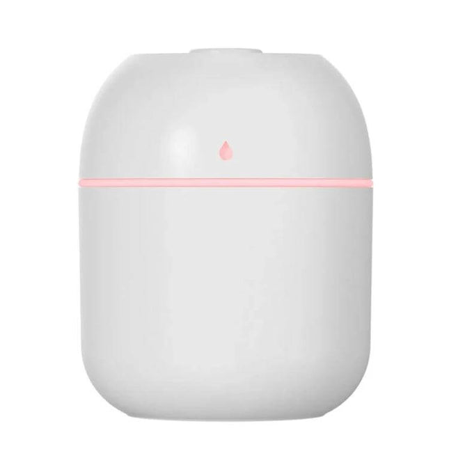 Quiet USB Plug In Humidifier For Car And Home Use Everyday - compact white 220ml USB plug-in humidifier with soft pink LED ring for cars and bedrooms
