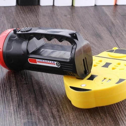 Rechargeable Outdoor LED Flashlight With Two Modes handheld black and red flashlight on wooden surface showing grip and charging dock
