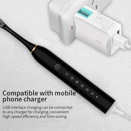 Rechargeable Ultrasonic Soft Bristle Toothbrush With 6 Modes 4 Heads shown in black with USB charging cable and mobile phone charger adapter