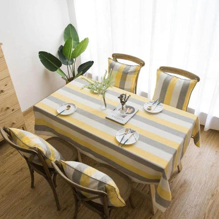 Rectangular Striped Tablecloth Cover For Dining Tables in neutral yellow gray stripes on a set table protecting tabletop from spills