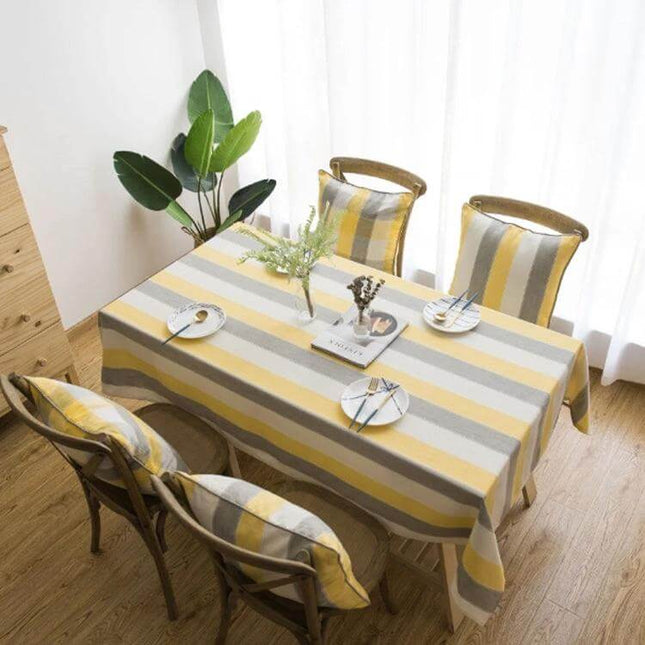 Rectangular Striped Tablecloth Cover For Dining Tables in neutral yellow gray stripes on a set table protecting tabletop from spills