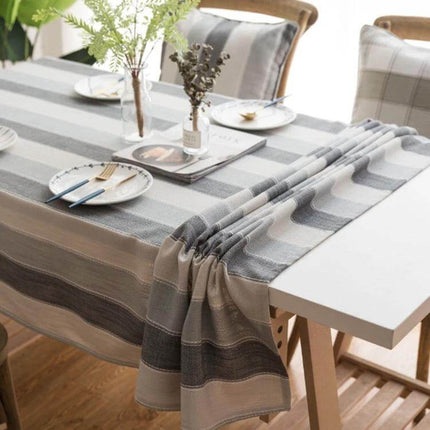 Rectangular Striped Tablecloth Cover For Dining Tables in neutral grey stripes on a dining table with plates and vase