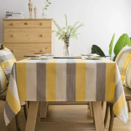 Rectangular Striped Tablecloth Cover For Dining Tables on wooden dining table with neutral yellow and gray stripes, waterproof polyester protection
