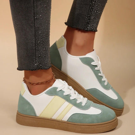 Retro Low Top Womens Green Casual Sneakers For Everyday Worn With Jeans, Featuring Round Toe And Cross-Strap Detailing.