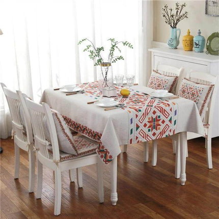 Retro Pattern Linen Tablecloth For Dinner, 140x140 Cm on a white dining table with geometric retro prints, linen cover and matching chair cushions