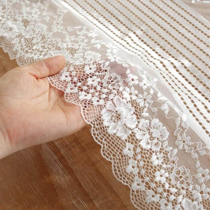 Romantic Lace Table Runner 120cm For Weddings And Dining - brocade lace close-up showing floral edge and neutral design on wooden table