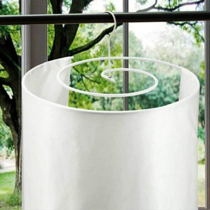 Round Balcony Spiral Drying Rack, 2.2m For Sheets And Duvet Covers hanging on balcony rod with white sheet on wrought iron spiral frame