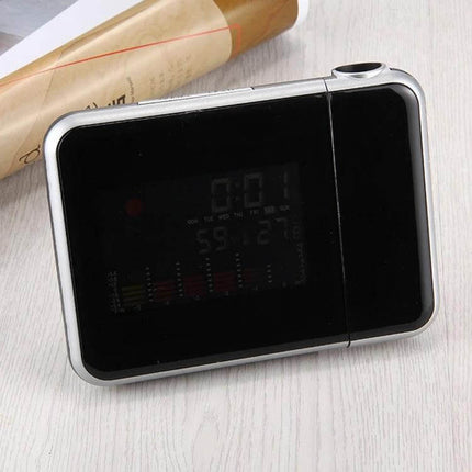 LED Projection Alarm Clock With Weather Station For Home on nightstand showing time temperature humidity and wall projection option