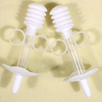 Balcherlam Baby Medicine Feeder Syringe Style Feeding Aid in clear food-grade plastic with ring handles and hygiene shield for baby dosing