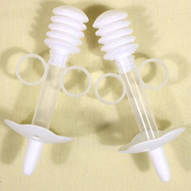 Balcherlam Baby Medicine Feeder Syringe Style Feeding Aid in clear food-grade plastic with ring handles and hygiene shield for baby dosing