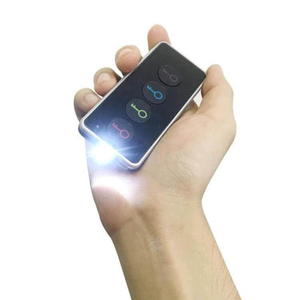 Wireless Smart Key Finder with LED Flashlight and Receivers handheld transmitter showing LED flashlight and three color-coded buttons