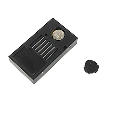 Mini LCD Indoor Thermometer With Humidity For Home Use - compact black battery-backed sensor unit showing coin cell and vented housing