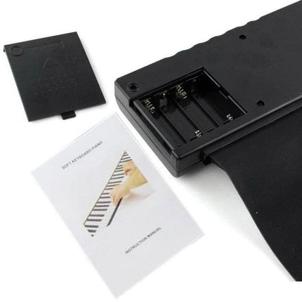 Datopal Roll-Up Piano for Everyday Home Music Sessions black flexible keyboard with open battery compartment and manual